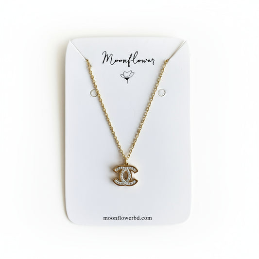 Sainless steel crystal-studded double c  necklace displayed on a moonflower branded jewelry card.