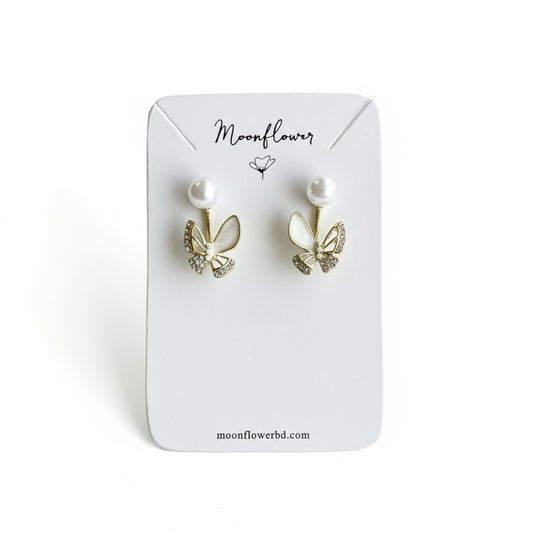 Butterfly-shaped earrings on a Moonflower branded card.