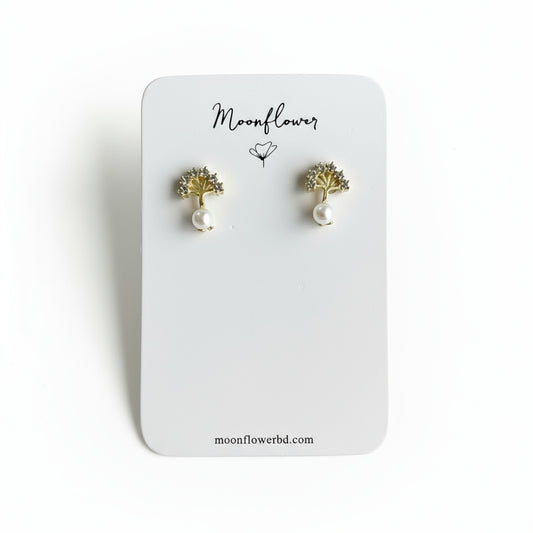 Pair of gold and pearl earrings on a 'Moonflower' branded card.