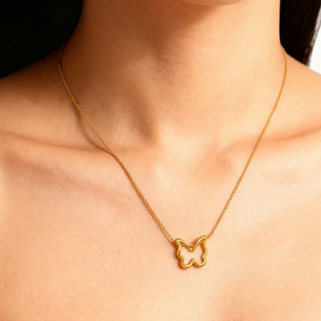 Model wearing butterfly necklace