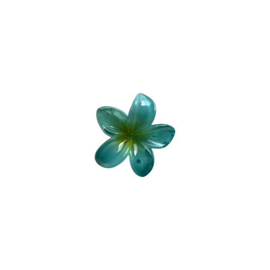 Teal green  plumeria hair claw on a white background