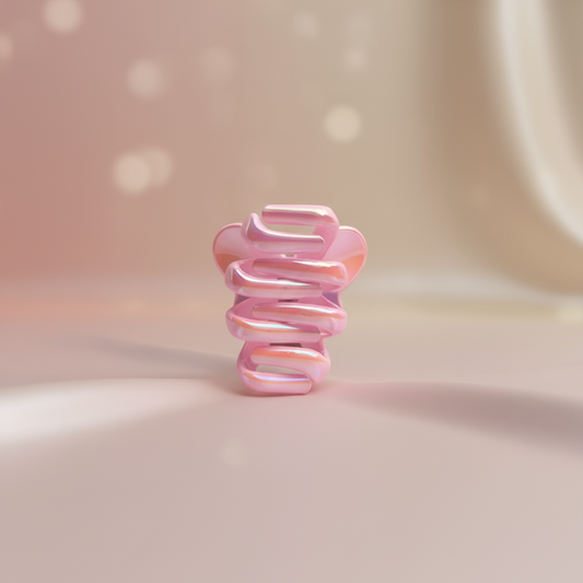 Rose gold spiral hair tie on a white background