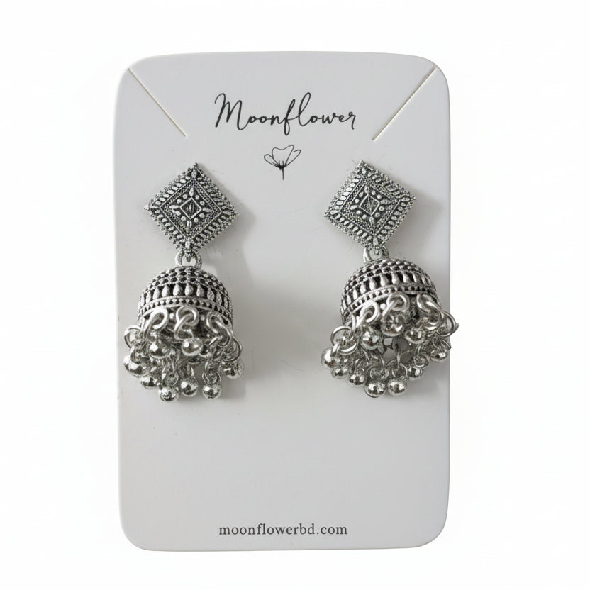 Silver earrings on a 'Moonflower' branded card with a white background