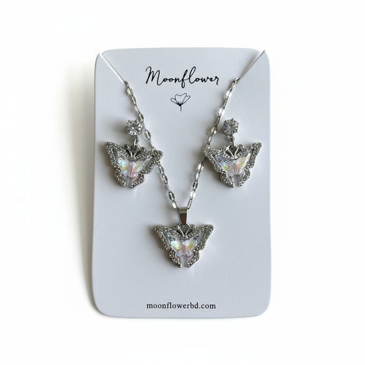 Jewelry set with necklace and earrings on a 'Moonflower' branded card.