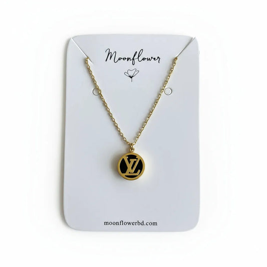 Necklace with a circular pendant on a 'Moonflower' branded card against a netutral background