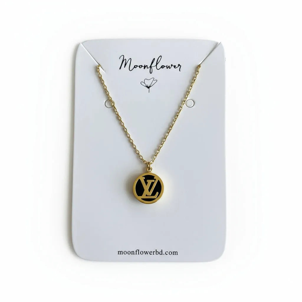 Necklace with a circular pendant on a 'Moonflower' branded card against a netutral background