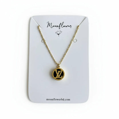 Necklace with a circular pendant on a 'Moonflower' branded card against a netutral background