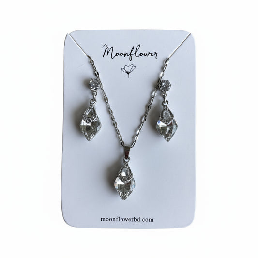 Jewelry set with necklace and earrings on a 'Moonflower' branded card.
