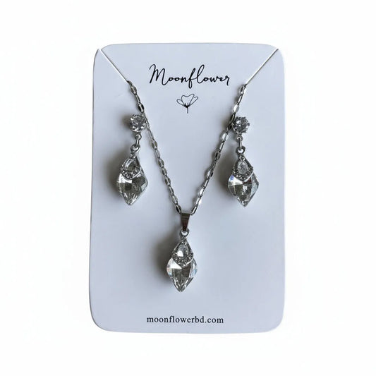 Jewelry set with necklace and earrings on a 'Moonflower' branded card.